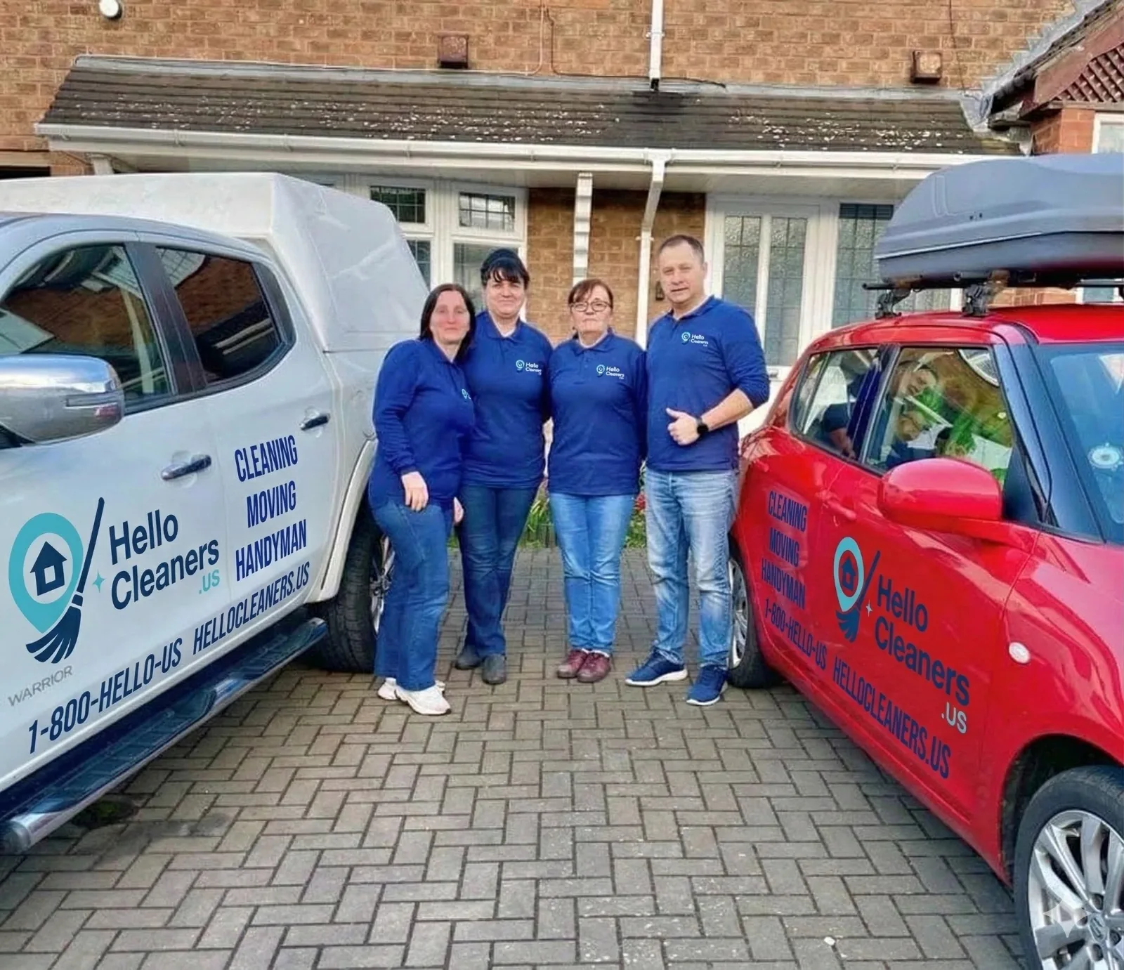 Four Hello Cleaners team members in branded uniforms between two company vehicles